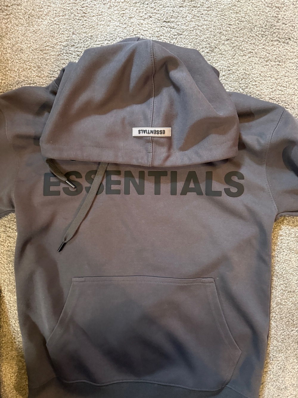 Fear of God ESSENTIALS Hoodie in Charcoal with Black Embossed Logo